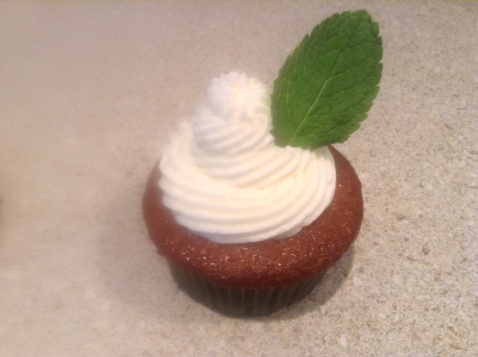 Pineapple Rum Mojito Cupcake with Pineapple Rum Buttercream Garnished with Fresh Mint