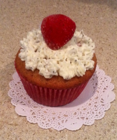 Strawberry Basil Cupcake with Basil Buttercream garnished with a Fresh Strawberry