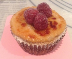 Crème Brûlée Cupcake with Fresh Raspberry Garnish